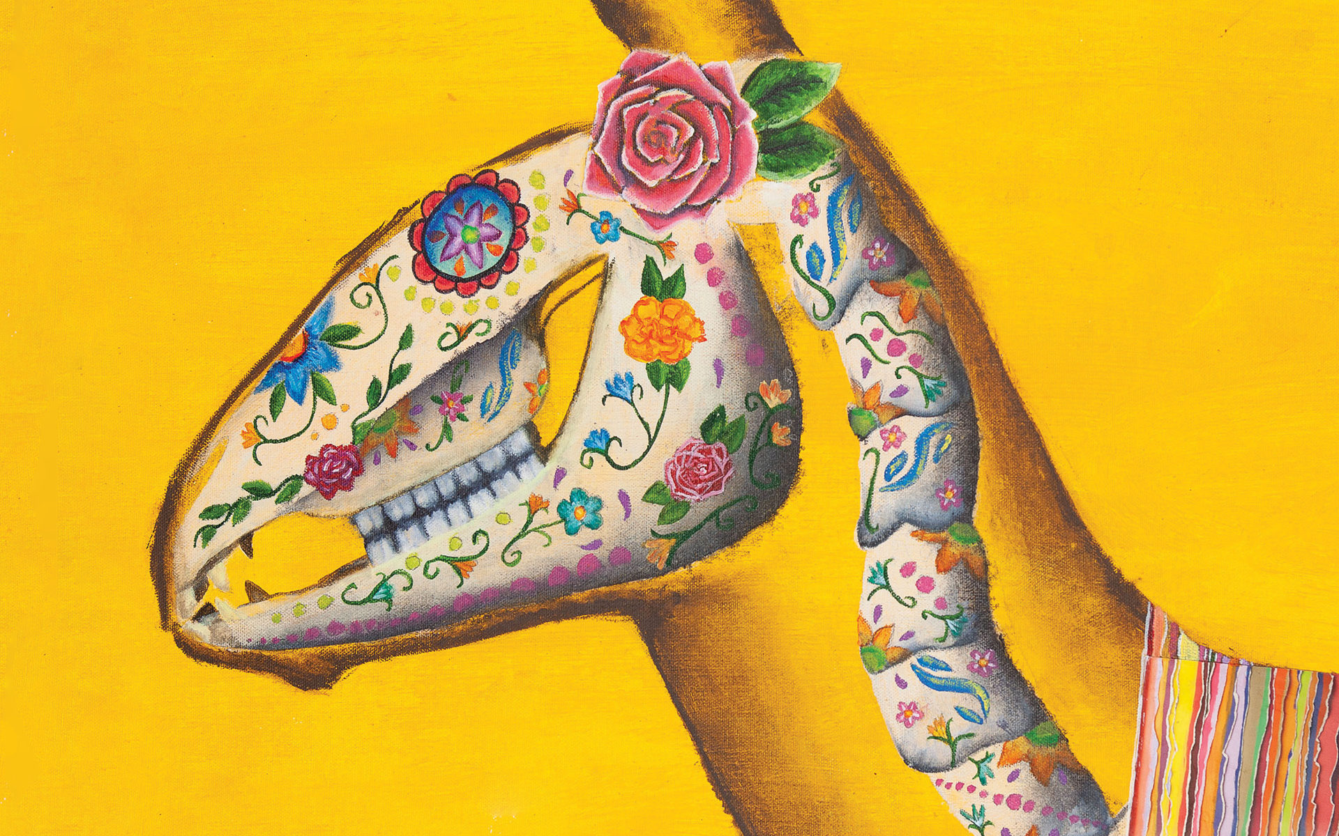 Painting of an animal skeleton elaborately painted with flowers and designs.