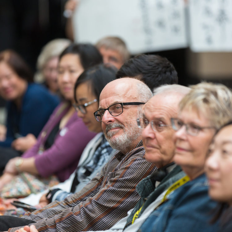 Row of seated people.