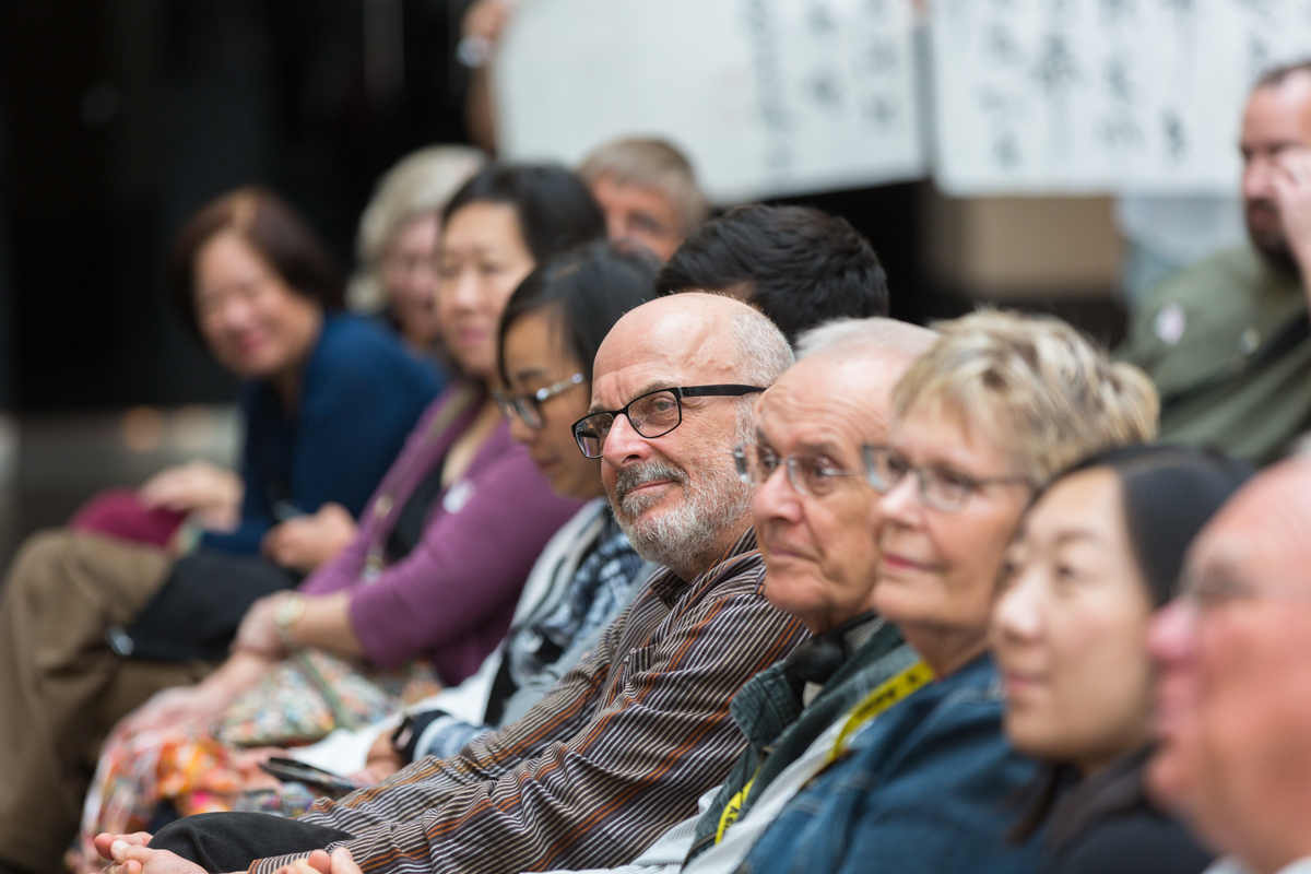 Row of seated people.