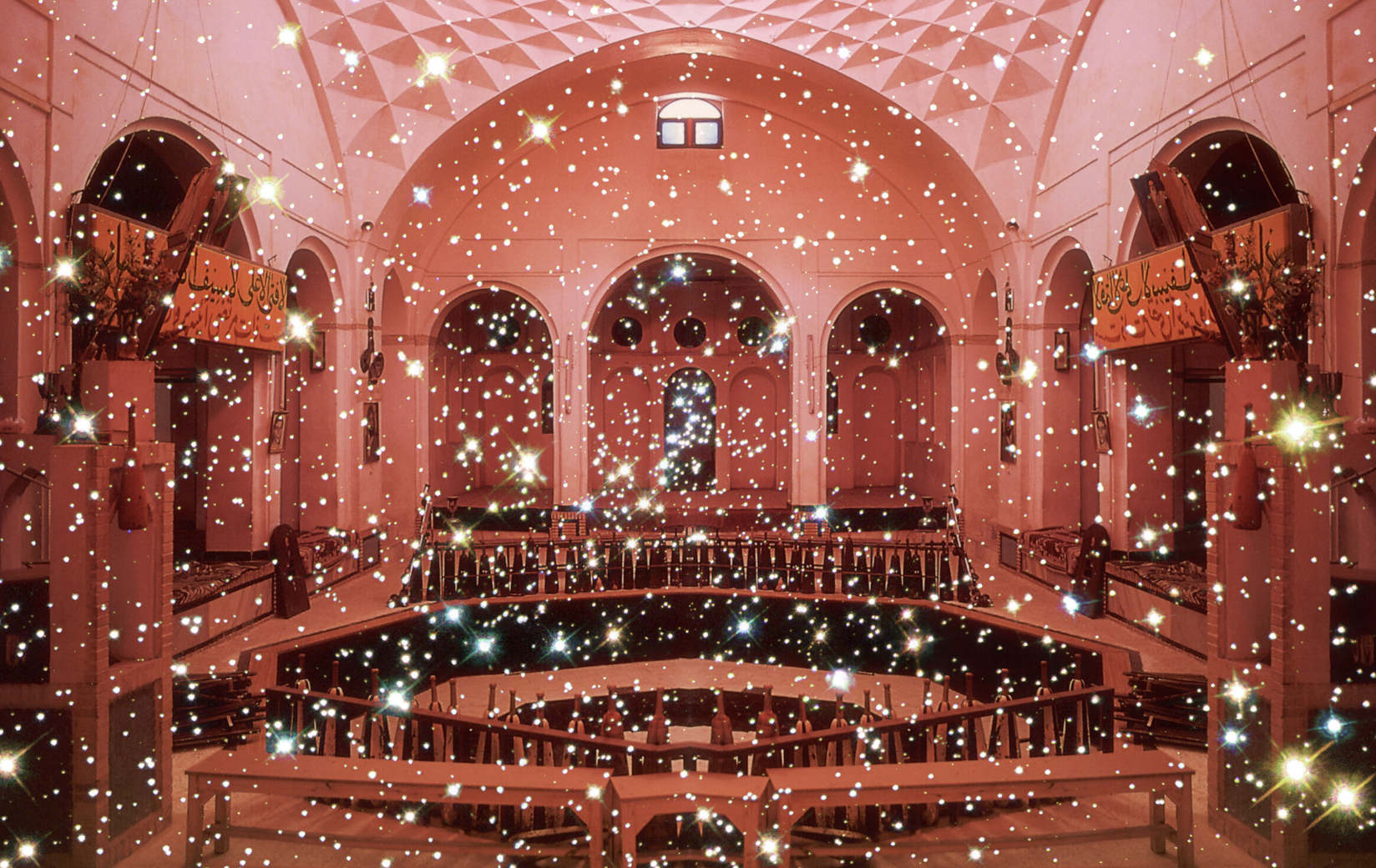 A room with a red filter and sparkles.