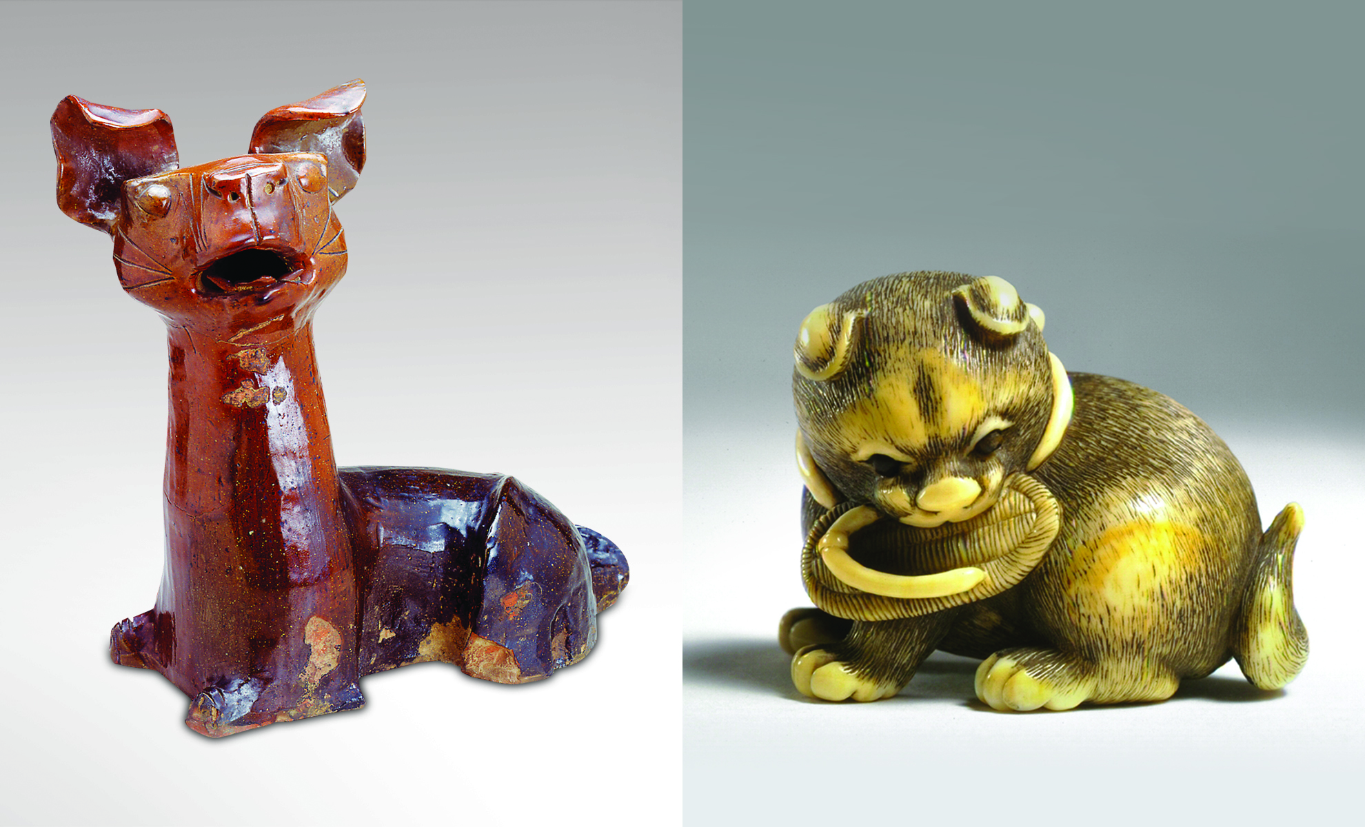 Two dogs side by side: (left) reddish-brown ceramic dog with cocked ears, (right) yellow-ish ivory dog carving with sandal in its mouth.