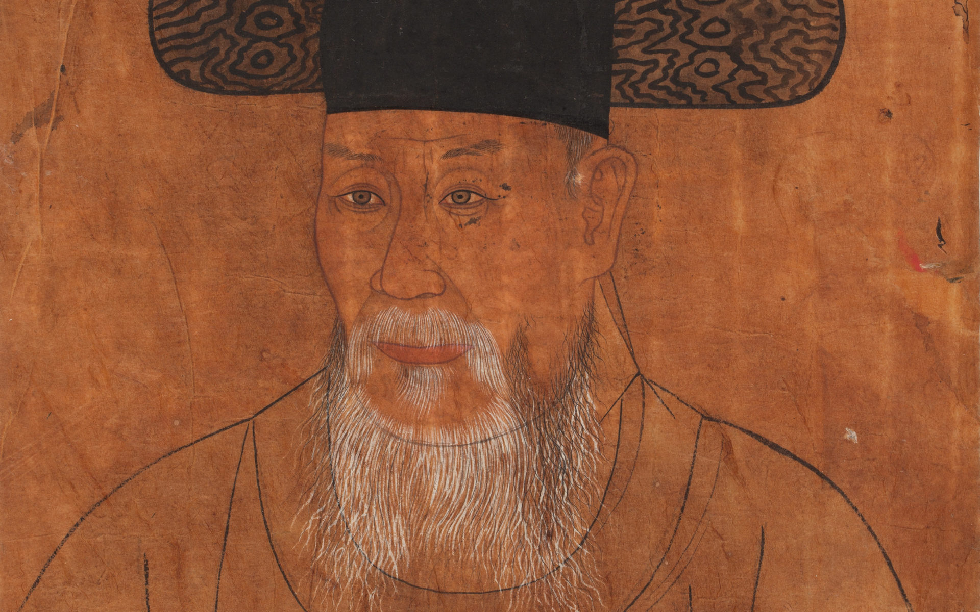 Portrait of the bust of a man with a tall and flaring black hat and long white beard.