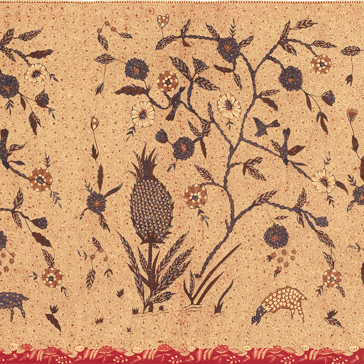 Rectangle of beige fabric with a repeating scene in browns, greens, and yellow of a pineapple plant and grazing animal below a flowering tree with birds alighting on its branches.