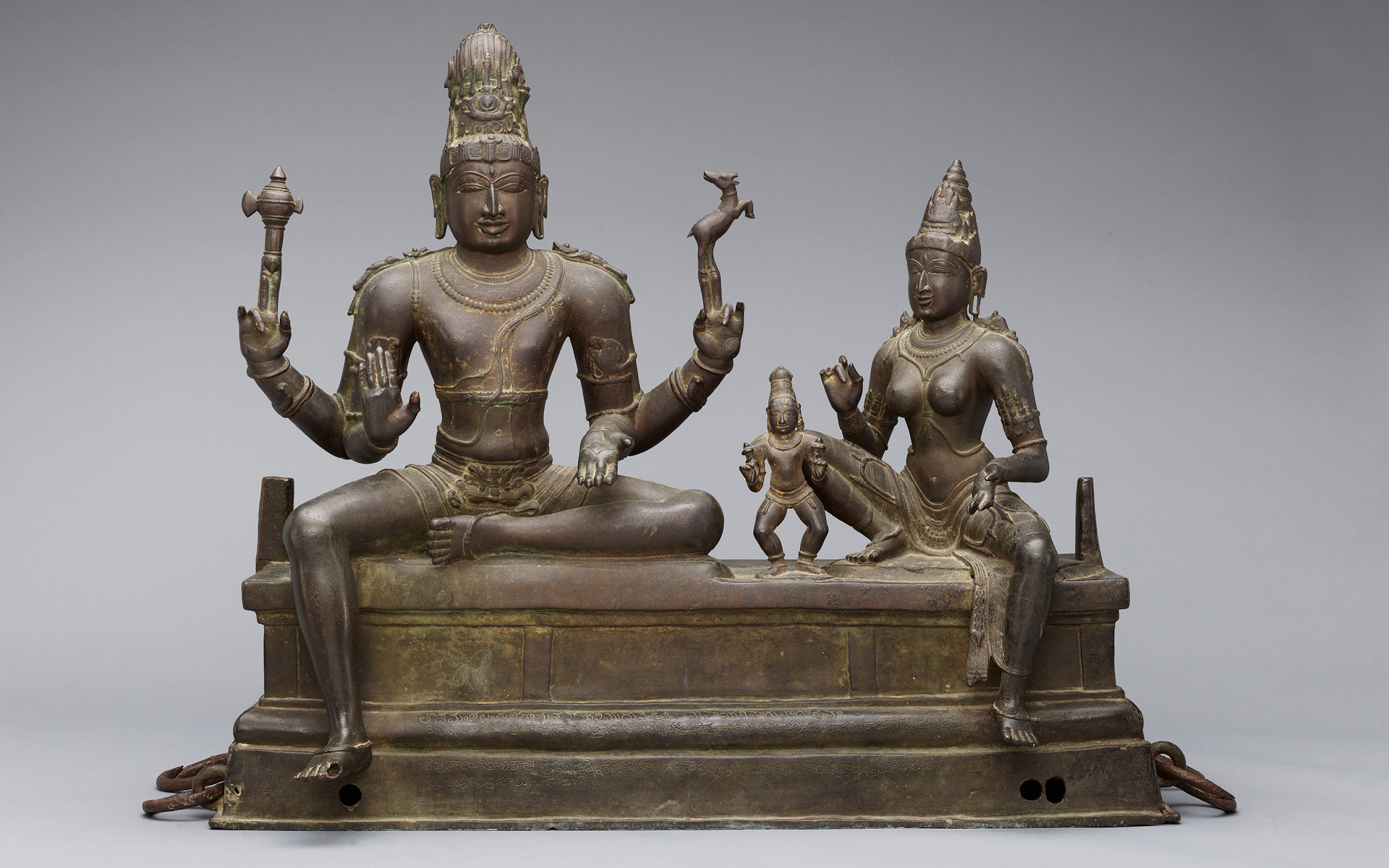 The Hindu deities Shiva and Parvati with their son Skanda in bronze.