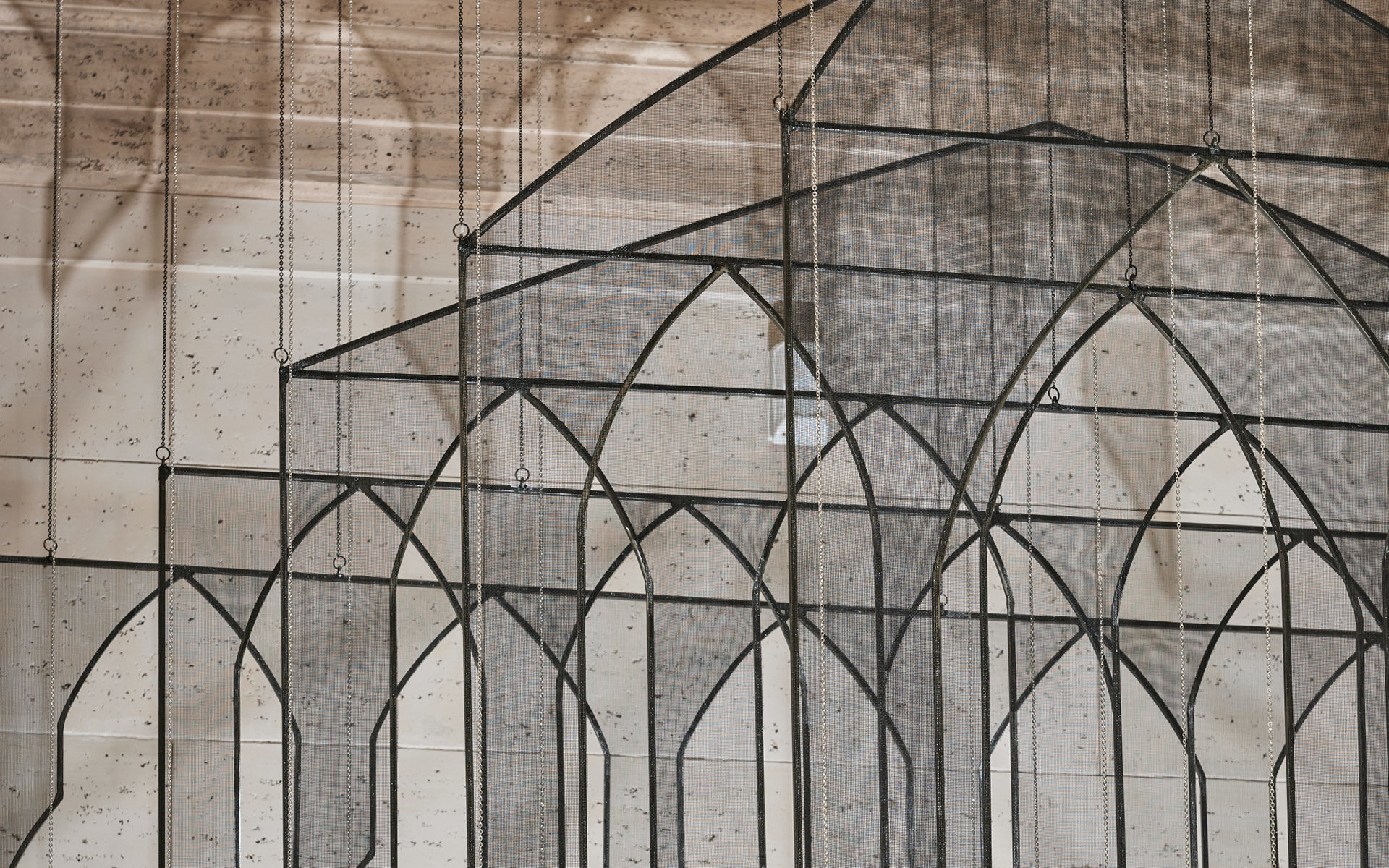 Installation view of My House, My Tomb, 2015/2021, by Afruz Amighi (American, b. Iran, 1974). Steel with fiberglass mesh, metal chains, and LED light. Lent by the artist. Photograph © Asian Art Museum.