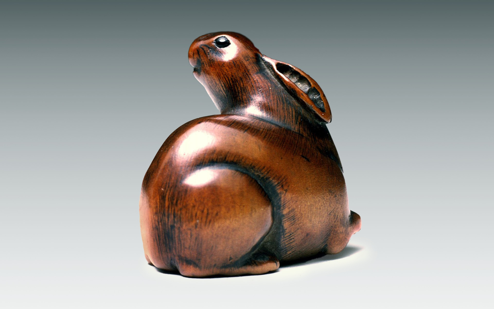 Rabbit, approx. 1800-1870. by Tomochika (Japanese, 1800 - 1873). Wood with inlaid horn eyes. Asian Art Museum, The Avery Brundage Collection, B70Y4. Photograph © Asian Art Museum of San Francisco.