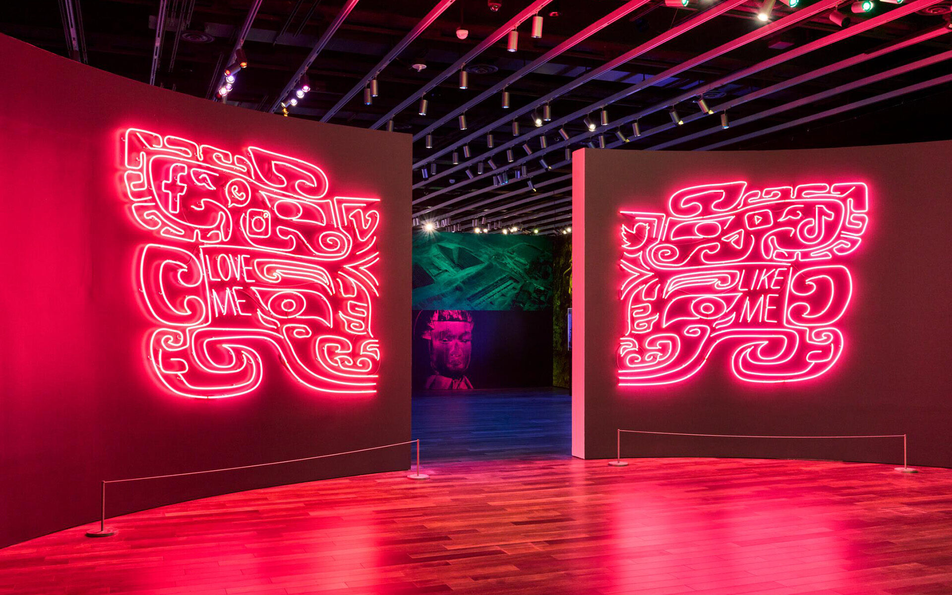 Pink neon artwork flanking a doorway.