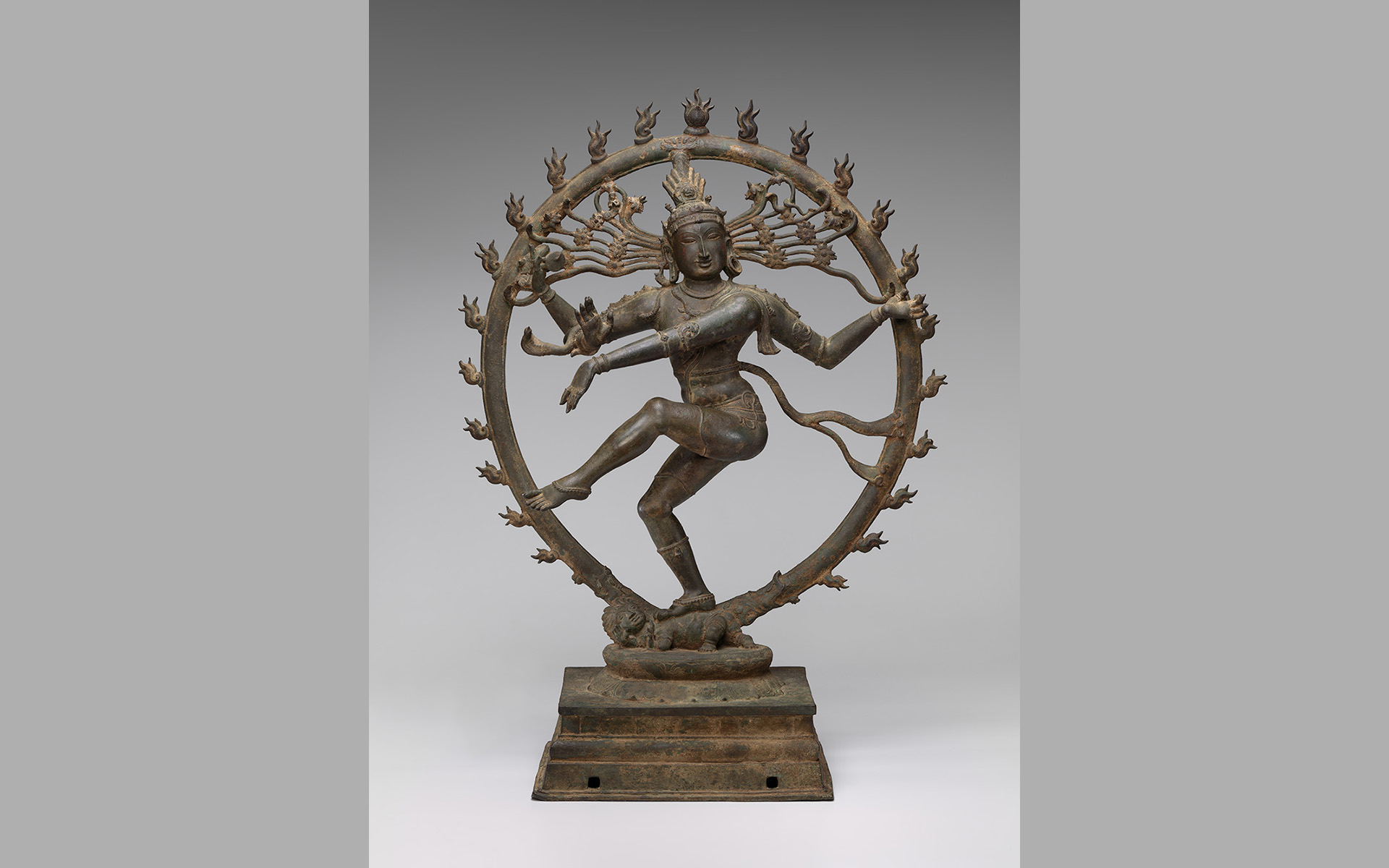 Bronze four-armed figure dancing encircled by a ring of flames.